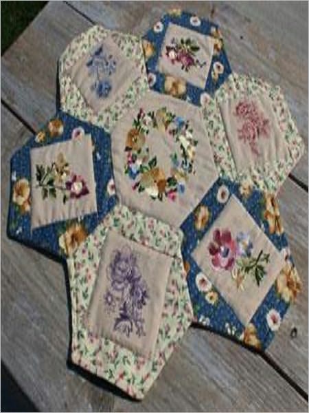 Daisy Table Topper Create your own daisy-shaped table topper with your favorite fabrics and embroidery designs, put a vase of wildflowers in the center, and transform your table!
