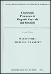 Electronic Processes in Organic Crystals and Polymers