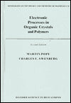 Electronic Processes in Organic Crystals and Polymers