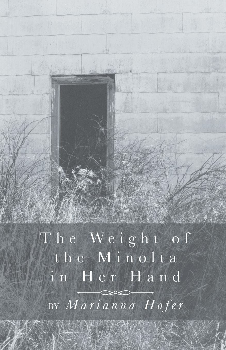 The Weight of the Minolta in Her Hand